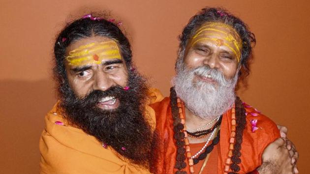 Yoga guru Baba Ramdev with Akhada Parishad President Mahant Narendra Giri at Baghambari Math, in Prayagraj (PTI) Yoga guru Baba Ramdev with Akhada Parishad President Mahant Narendra Giri at Baghambari Math, in Prayagraj (PTI)