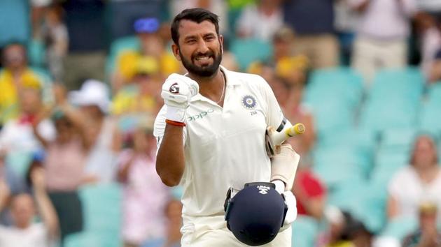 India's Cheteshwar Pujara celebrates his century (100 runs) during the first day of the fourth and final cricket Test against Australia at the Sydney Cricket Ground in Sydney.(AFP)