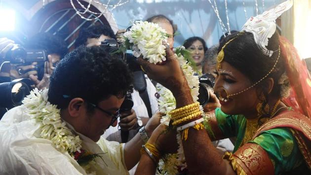 The image shows Tista Das and Dipan Chakraborty getting married in a traditional bengali ceremony. (AFP File Photo) The image shows Tista Das and Dipan Chakraborty getting married in a traditional bengali ceremony. (AFP File Photo)