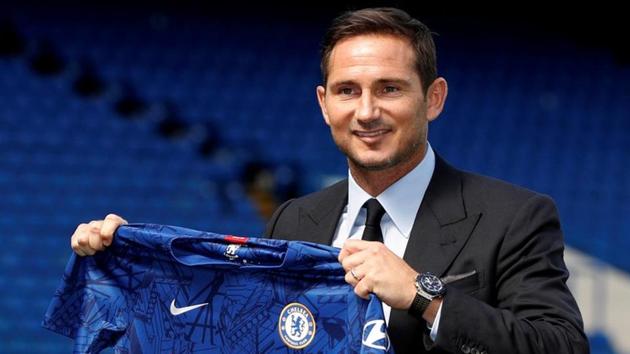 Chelsea manager Frank Lampard holds up a shirt on the pitch after the press conference. (Action Images via Reuters) Chelsea manager Frank Lampard holds up a shirt on the pitch after the press conference. (Action Images via Reuters)