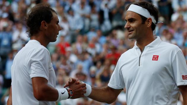 Switzerland's Roger Federer (R) shakes hands and embraces Spain's Rafael Nadal (L). (AFP) Switzerland's Roger Federer (R) shakes hands and embraces Spain's Rafael Nadal (L). (AFP)