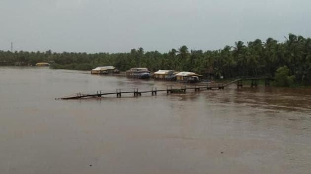 A bridge was swept away in gushing waters in north Kerala’s Kasargode.(HT Photo)