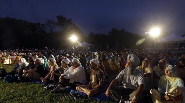 File photo shows hundreds participate in a candlelight vigil at the Sikh Temple of Wisconsin to mark the one-year anniversary of the shooting rampage that left six dead in Oak Creek, Wisconsin.(AP)