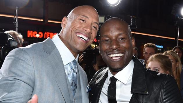 Dwayne Johnson, left, and Tyrese Gibson arrive at the premiere of Fast & Furious 7 in Los Angeles.(AP)