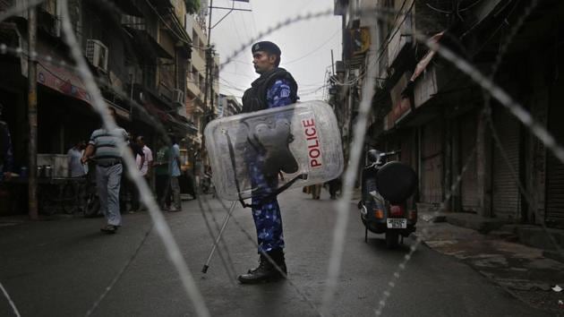 A Rapid Action Force (RAF) personnel stand guard during restrictions in Jammu, Friday, Aug 9, 2019. (PTI) A Rapid Action Force (RAF) personnel stand guard during restrictions in Jammu, Friday, Aug 9, 2019. (PTI)