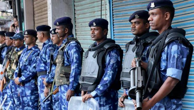 Security personnel stand guard during the restrictions in Jammu on Friday.(ANI photo)