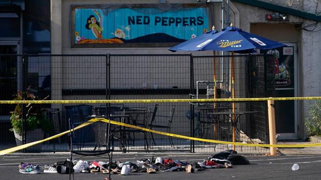 Shoes are piled in the rear of Ned Peppers Bar at the scene after a mass shooting in Dayton, Ohio, USA. (Bryan Woolston / REUTERS)