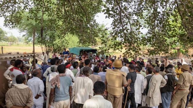 Villagers gather at the site where atleast 9 people were gunned down over a property dispute on July 18, 2019.(PTI) Villagers gather at the site where atleast 9 people were gunned down over a property dispute on July 18, 2019.(PTI)