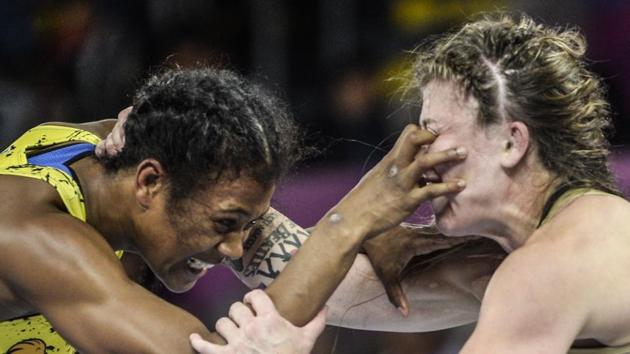 USA’s Jenna Burkert (R) and Ecuador's Lissette Antes compete in the Wrestling Women's Freestyle 57 kg final during the Lima 2019 Pan-American Games in Lima, Peru. Antes won the gold medal. (Ernesto Benavides / AFP)