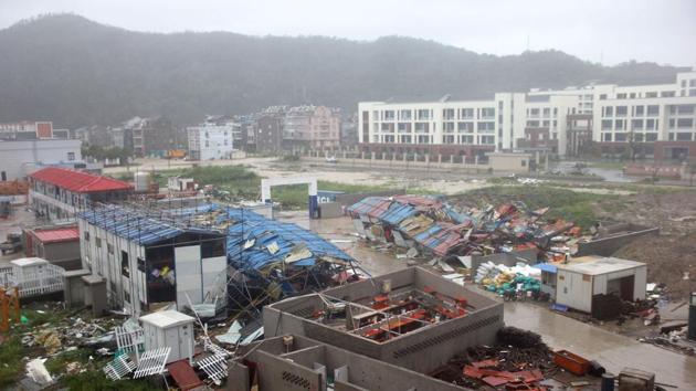 Damaged worker accommodation buildings are seen at a construction site in Wenling City, in China's eastern Zhejiang province after being hit by Typhoon Lekima today. At least 18 people were killed and 14 others missing as Typhoon Lekima lashed eastern China, downing thousands of trees and forcing more than a million people from their homes. (AFP / China OUT)