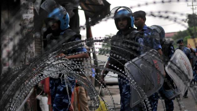 Rapid Action Force (RAF) personnel patrol a street during restrictions, in Jammu, India, on Friday, Aug 9, 2019.(Nitin Kanotra/ Hindustan Times)