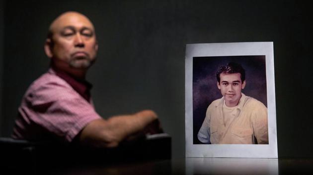 Robby Perez, 48, in New Orleans, sits beside a photo of himself when he was 14 years old, the age when he says in a lawsuit he was sexually abused as an altar boy in Guam by David Anderson, a former priest now living in Hawaii. Perez says he endured five years of sexual abuse, never telling anyone. At least 223 lawsuits have been filed alleging abuse by 35 clergymen, teachers and Boy Scout leaders tied to the Catholic Church. (David Goldman / AP) Robby Perez, 48, in New Orleans, sits beside a photo of himself when he was 14 years old, the age when he says in a lawsuit he was sexually abused as an altar boy in Guam by David Anderson, a former priest now living in Hawaii. Perez says he endured five years of sexual abuse, never telling anyone. At least 223 lawsuits have been filed alleging abuse by 35 clergymen, teachers and Boy Scout leaders tied to the Catholic Church. (David Goldman / AP)