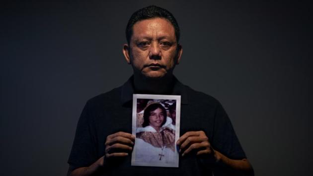 Roland Sondia, 57, holds a photo of himself when he was about 15 years old, the age when he says he was sexually abused by then Archbishop of Agana, Anthony Apuron, in Hagatna. “I keep asking myself why me,” said Sondia. “I keep thinking back to what I could have done to make him want to approach me. I did a good job of hiding it. It’s something I’ll take to my grave.” (David Goldman / AP) Roland Sondia, 57, holds a photo of himself when he was about 15 years old, the age when he says he was sexually abused by then Archbishop of Agana, Anthony Apuron, in Hagatna. “I keep asking myself why me,” said Sondia. “I keep thinking back to what I could have done to make him want to approach me. I did a good job of hiding it. It’s something I’ll take to my grave.” (David Goldman / AP)