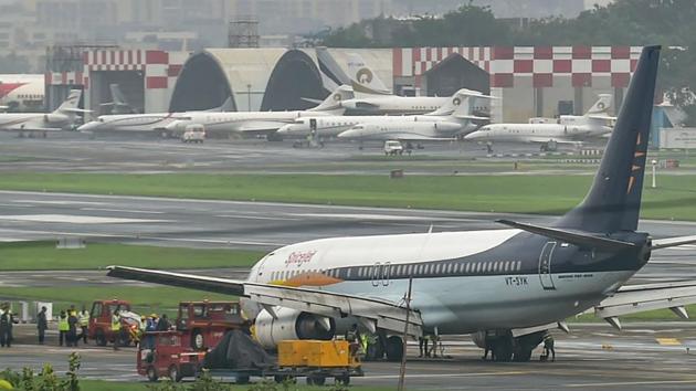 A team of engineers and technicians from Air India tow away a SpiceJet aircraft from the runway at Chhatrapati Shivaji Maharaj International Airport, in Mumbai. (PTI) A team of engineers and technicians from Air India tow away a SpiceJet aircraft from the runway at Chhatrapati Shivaji Maharaj International Airport, in Mumbai. (PTI)