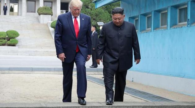 US President Donald Trump and North Korean leader Kim Jong Un cross over a military demarcation line at the demilitarized zone (DMZ) separating the two Koreas, in Panmunjom, South Korea.(Reuters Photo) US President Donald Trump and North Korean leader Kim Jong Un cross over a military demarcation line at the demilitarized zone (DMZ) separating the two Koreas, in Panmunjom, South Korea.(Reuters Photo)