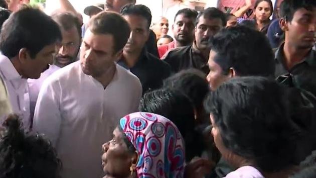 Kerala, Aug 11 (ANI): Congress leader Rahul Gandhi and KC Venugopal talk to flood-affected people at a relief camp in Wayanad on Sunday. (ANI Photo)