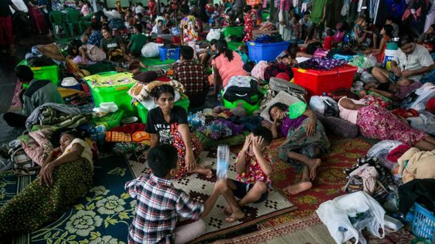 Displaced residents take shelter in a temporary evacuation centre. Families realised they had to leave in the early hours Sunday, packing possessions into boats, rowing towards higher ground or swimming away. Than Htay, a 40-year-old from Ye town said that water rose to their waists around 02:00 am and she and her family members started shouting for help. The heavy rains muffled their pleas but a boat happened to pass by and gave them a ride. “That’s why we survived. We thought we were dead,” she said. (Sai Aung Main / AFP) Displaced residents take shelter in a temporary evacuation centre. Families realised they had to leave in the early hours Sunday, packing possessions into boats, rowing towards higher ground or swimming away. Than Htay, a 40-year-old from Ye town said that water rose to their waists around 02:00 am and she and her family members started shouting for help. The heavy rains muffled their pleas but a boat happened to pass by and gave them a ride. “That’s why we survived. We thought we were dead,” she said. (Sai Aung Main / AFP)