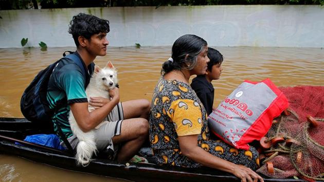 A flood-affected boy carries his dog as he and others are moved to a safer place in Paravur in Ernakulam district in the southern state of Kerala. The army, air force and the NDRF had launched massive relief and rescue operation in Kerala after incessant heavy rain had deluged the state. (Sivaram V / REUTERS) A flood-affected boy carries his dog as he and others are moved to a safer place in Paravur in Ernakulam district in the southern state of Kerala. The army, air force and the NDRF had launched massive relief and rescue operation in Kerala after incessant heavy rain had deluged the state. (Sivaram V / REUTERS)