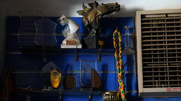 Souvenirs lie on shelves at the Equestrian Club, in Khartoum. (Andreea Campeanu / REUTERS) Souvenirs lie on shelves at the Equestrian Club, in Khartoum. (Andreea Campeanu / REUTERS)