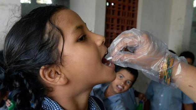 A school girl recieves a deworming tablet as part of India's National Deworming Programme at a school in Hyderabad. (NOAH SEELAM / AFP) A school girl recieves a deworming tablet as part of India's National Deworming Programme at a school in Hyderabad. (NOAH SEELAM / AFP)