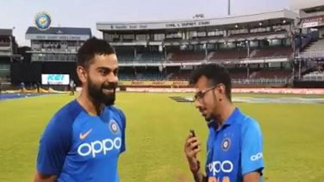 Virat Kohli speaks with Yuzvendra Chahal after the 2nd ODI against West Indies.(Twitter/BCCI)