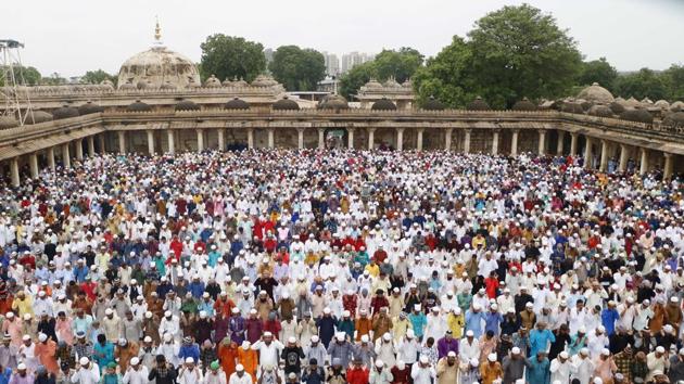 People offer Eid al-Adha prayer at Sarkhej Roza in Ahmedabad, Gujarat. Other than prepping the feast, people also visit mosques, offer prayers, exchange gifts, meet and greet their loved ones and together enjoy several delicacies that are prepared on the occasion. (Siddharaj Solanki / HT Photo)