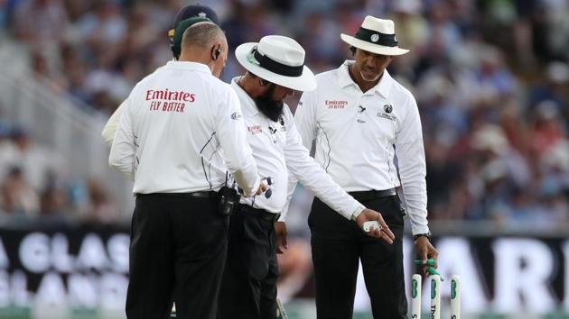 Umpire Aleem Dar calls an end to play due to low light.(Action Images via Reuters)