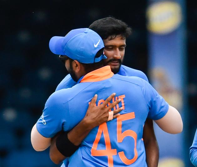 Rohit Sharma (L) and Khaleel Ahmed (R) of India celebrate the dismissal of Shai Hope. (AFP)