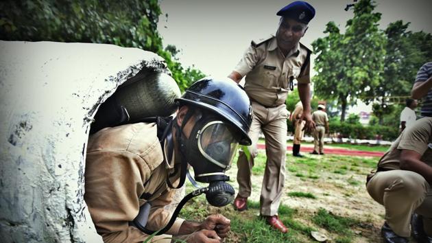 While rescuing people in confined places such as sewer lines and manholes, firemen wear self-contained breathing apparatus sets, to maintain oxygen levels. With a face mask and an oxygen cylinder, it allows the personnel to breath for up to 40 minutes. (Raj K Raj / HT Photo) 