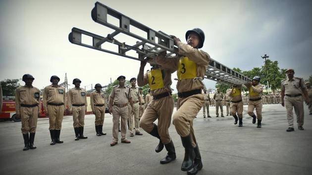 Cadets carry a ladder during a drill. In case of fires in buildings, ladders are used by the firemen to reach the site of the fire and douse it. (Raj K Raj / HT Photo) 