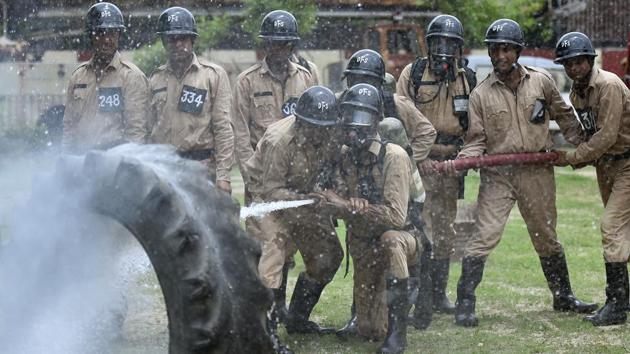 Cadets use water to douse fire during a drill. Fires kill around 80 people in the city every year. To ably combat these fires, the role of the firemen cannot be understated. (Raj K Raj / HT Photo) 