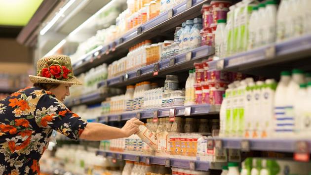 A customer browses dairy products in a refrigerated cabinet inside a Perekrestok supermarket, operated by X5 Retail Group NV, in Moscow, Russia.(Bloomberg)