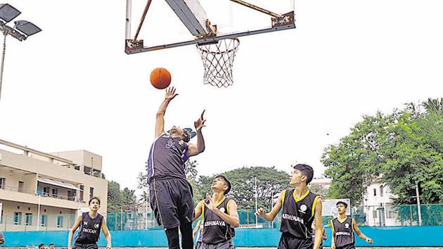 A Deccan Gymkhana A player attempts a basket at the semi-final match against Abhinava Vidyalaya at Deccan Gymkhana in Pune, India, on Sunday. (RAHUL RAUT/HT) A Deccan Gymkhana A player attempts a basket at the semi-final match against Abhinava Vidyalaya at Deccan Gymkhana in Pune, India, on Sunday. (RAHUL RAUT/HT)