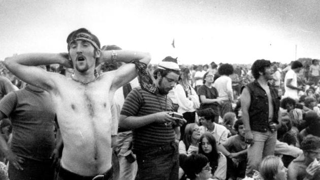 Music fans relax during a break in the entertainment at the Woodstock Music and Arts Fair in Bethel, N.Y. (AP) Music fans relax during a break in the entertainment at the Woodstock Music and Arts Fair in Bethel, N.Y. (AP)