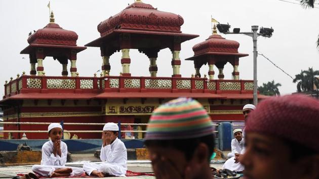 Boys seen during a special prayer organised to celebrate Eid al-Adha in Kolkata, West Bengal. The meat of the sacrificed animal is distributed equally in three parts. The person making the sacrifice keeps one part for his family while the other two parts are distributed among relatives and the poor. (Dibyangshu Sarkar / AFP)
