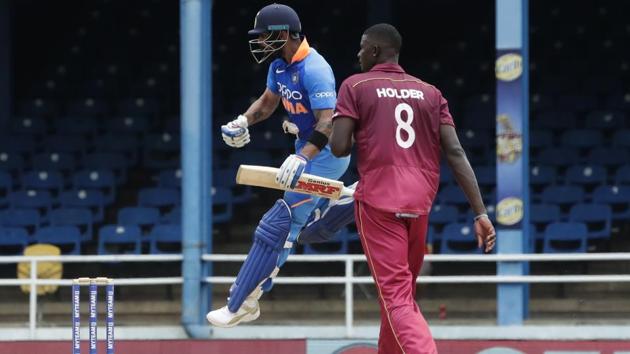 India's captain Virat Kohli jumps into the air while celebrating his century.(AP)