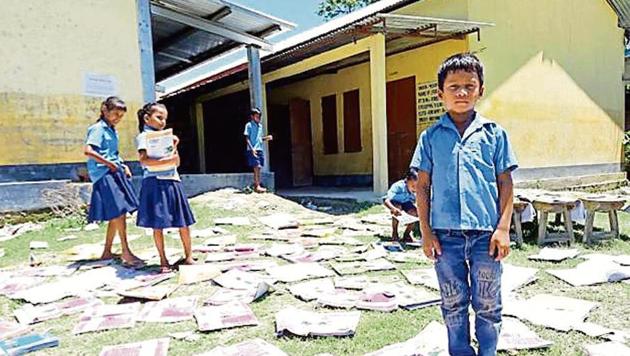 Students have put out their books to dry. (Utpal Parashar/HT photo) Students have put out their books to dry. (Utpal Parashar/HT photo)