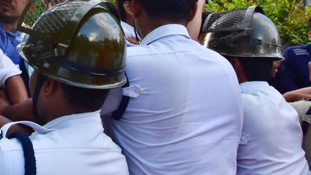 Slum dwellers from Chetla attacked a constable in Tollygunge police station. In this file pic, Kolkata policemen are seen trying to control Congress protest against Uttar Pradesh Chief Minister Yogi Adityanath for the Justice to Unnao rape victim at a demonstration rally in Kolkata last week. (ANI PHOTO) Slum dwellers from Chetla attacked a constable in Tollygunge police station. In this file pic, Kolkata policemen are seen trying to control Congress protest against Uttar Pradesh Chief Minister Yogi Adityanath for the Justice to Unnao rape victim at a demonstration rally in Kolkata last week. (ANI PHOTO)