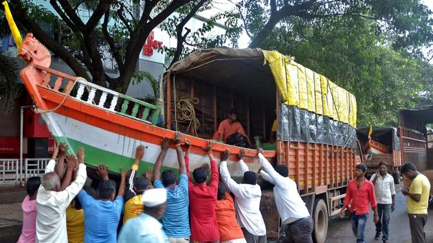 Sangli: Workers load a boat in a truck to carry out rescue and relief operations, in Sangli district. (Photo: PTI) Sangli: Workers load a boat in a truck to carry out rescue and relief operations, in Sangli district. (Photo: PTI)