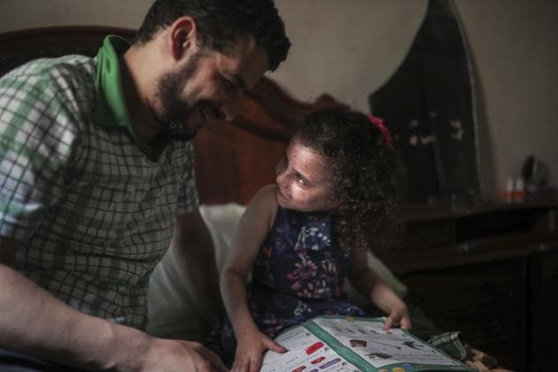 The donations from Ghazaoui’s group reach families like those of Said El Mohamadi, a tailor in the city of Salé, whose 6-year-old daughter has the condition. His family is still debating the topic of school. “She’s sad, but I can’t risk taking her to school where there isn’t any kind of protection,” he said. “But she needs an education,” her mother Maria El Maroufi pleads. (Mosa'ab Elshamy / AP)