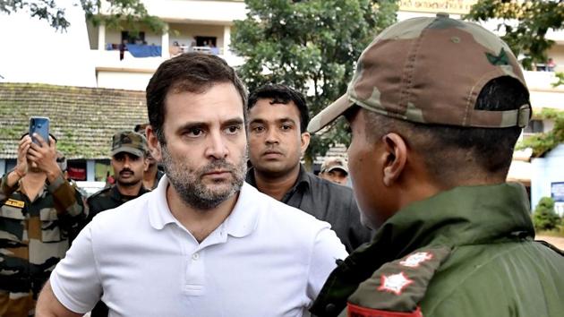 Rahul Gandhi interacts with army personnel involved in rescue and relief operations in the flood affected areas in Wayanad district on Monday, August 12.(PTI)