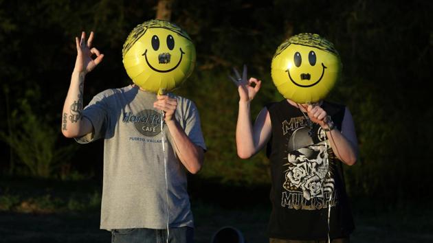 Members of the ShieldWall Network hold up balloons decorated as the face of Adolf Hitler and give a white-power hand signal as they celebrate the German fascist's birthday outside Atkins. Two years ago, America’s white nationalist movement stunned the country. Neo-Nazi demonstrations in Charlottesville, Virginia, had turned deadly when a far-right protester drove a car through a crowd, killing one and injuring dozens. (Jim Urquhart / REUTERS)