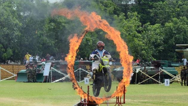 A member of ASC Tornados, the motorcycle display team of the Indian Army, jumps through a ring of fire as he performs a stunt during 73rd Independence Day in Amritsar. (NARINDER NANU / AFP) A member of ASC Tornados, the motorcycle display team of the Indian Army, jumps through a ring of fire as he performs a stunt during 73rd Independence Day in Amritsar. (NARINDER NANU / AFP)