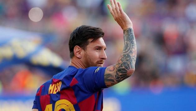 Barcelona's Lionel Messi waves to fans before the match.(REUTERS)