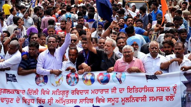 Members of Guru Ravidas Sabha Punjab during a protest march over the demolition of Guru Ravidas temple in Delhi, during Punjab Band Call in Amritsar on Tuesday, August 13, 2019.(ANI Photo) Members of Guru Ravidas Sabha Punjab during a protest march over the demolition of Guru Ravidas temple in Delhi, during Punjab Band Call in Amritsar on Tuesday, August 13, 2019.(ANI Photo)