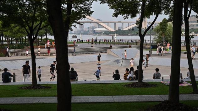 People skateboarding at a park near the Shanghai Long Museum in Shanghai. There is a sign saying the area is for skateboarding only, but it is so small that few people see it and security guards show little desire to enforce the rule. The facility is also falling into disrepair, the concrete cracked and crumbling, while metal grooves running along the ground are an unwelcome hazard. (HECTOR RETAMAL / AFP)