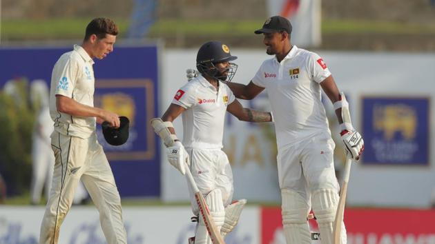 Sri Lankan batsmen Niroshan Dickwella, center, and Suranga Lakmal cheer each others.(AP)