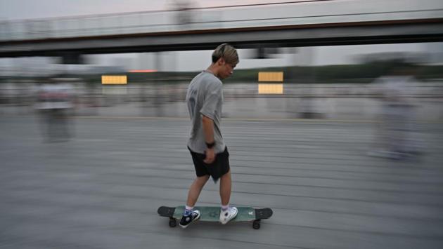 Earlier older people would think that skateboarders are not good kids and skateboarding is not a good sport. However, the local sports authority has begun organising competitions and old-fashioned attitudes are slowly changing. But while perceptions are softening, skateboarders say they face a squeeze on where they can go. There are paid-for facilities in Shanghai, but these tend to be expensive and inconvenient to reach, say many skateboarders. (HECTOR RETAMAL / AFP)