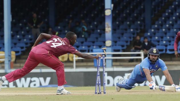 India's Rohit Sharma, right, is run out by West Indies' Kemar Roach for 10 runs during the third One-Day International cricket match in Port of Spain, Trinidad, Wednesday, Aug. 14, 2019. (AP) India's Rohit Sharma, right, is run out by West Indies' Kemar Roach for 10 runs during the third One-Day International cricket match in Port of Spain, Trinidad, Wednesday, Aug. 14, 2019. (AP)