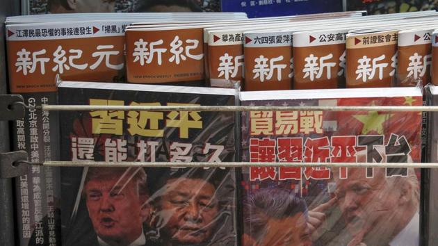 In this July 4, 2019, photo, Chinese magazines with front covers featuring Chinese President Xi Jinping and U.S. President Donald Trump on trade war are placed for sale at a roadside bookstand in Hong Kong.(Photo: AP)